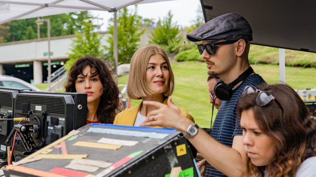Eiza Gonzlez, Rosamund Pike, and Director J Blakeson on the set of the Netflix film I Care A Lot.