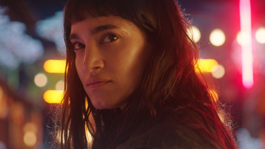 Sofia Boutella in the neon lit Samurai Town as seen in Prisoners of the Ghostland.