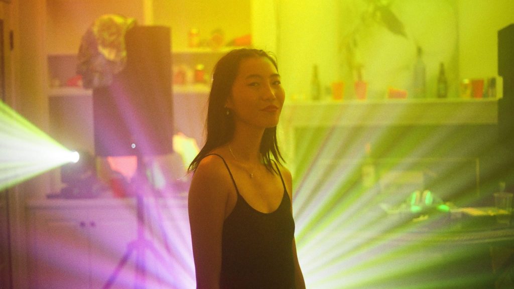 Shirley Chen as Krista in a dance room with yellow lights as seen in the new indie teen drama Beast Beast.