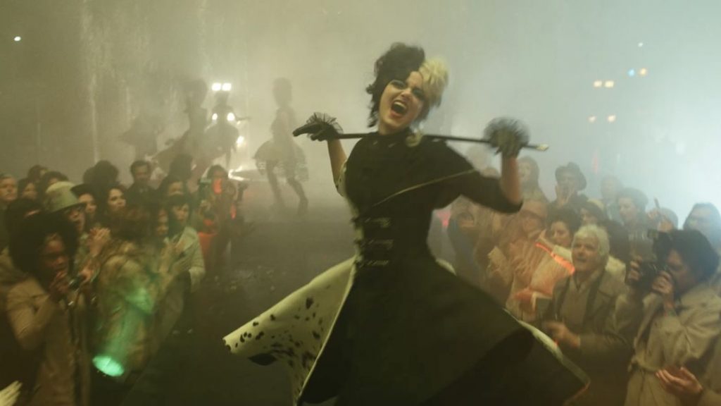 Emma Stone as Cruella rocking the runway in black and white spotted dress as seen in the new Disney live-action film.