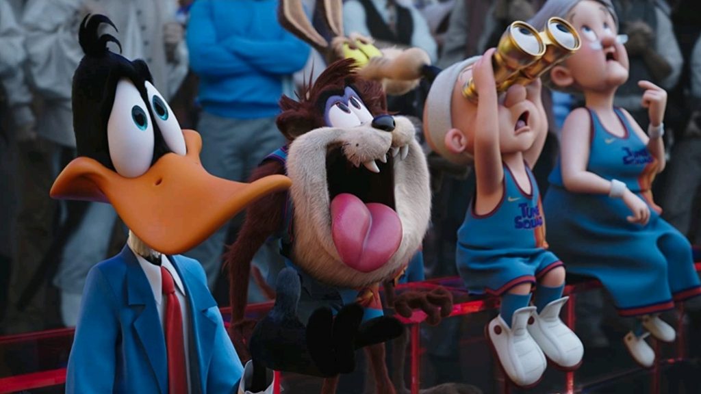 Daffy Duck, Taz, Elmer Fudd, and Granny watching the final basketball game from the bench as seen in SPACE JAM: A NEW LEGACY.