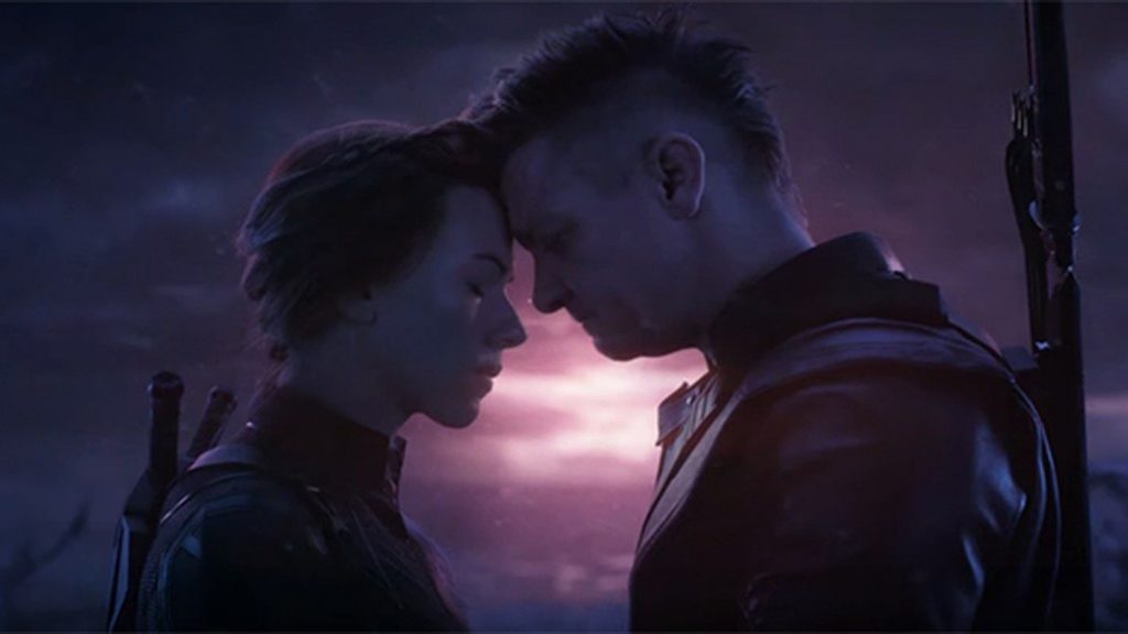 Black Widow and Hawkeye sharing an intimate moment on Vormir as seen in Marvel Studios' Avengers: Endgame.