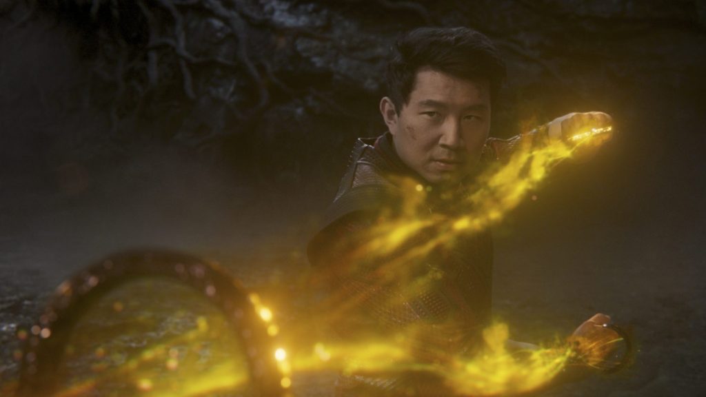 Simu Liu harnessing the golden energy of the ten rings in a fight against the mandarin as seen in the new marvel film SHANG-CHI AND THE LEGEND OF THE TEN RINGS.