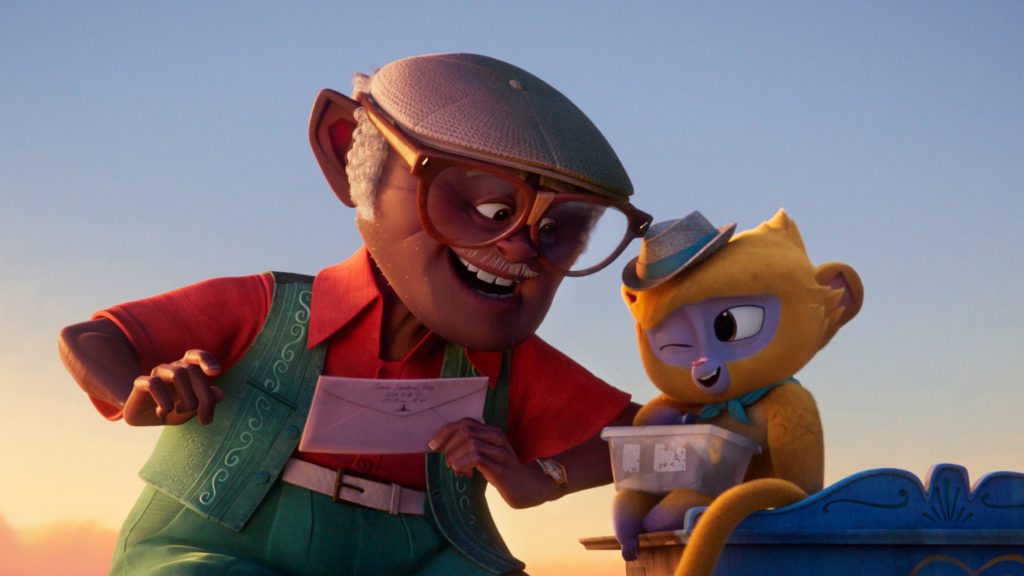 Vivo the yellow Kinkajou voiced by Lin-Manuel Miranda writing a love letter with his human partner Andres voiced by Juan de Marcos Gonzalez in Cuba as seen in the new Sony animated film to hit Netflix VIVO.