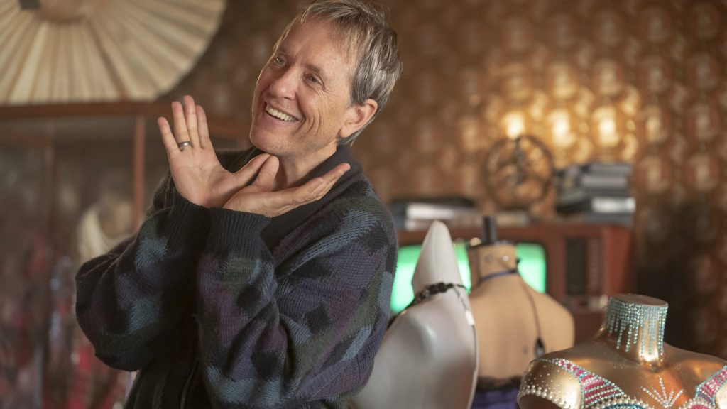 Richard E Grant making a happy pose as Hugo Battersby / Loco Chanelle in EVERYBODY'S TALKING ABOUT JAIME.