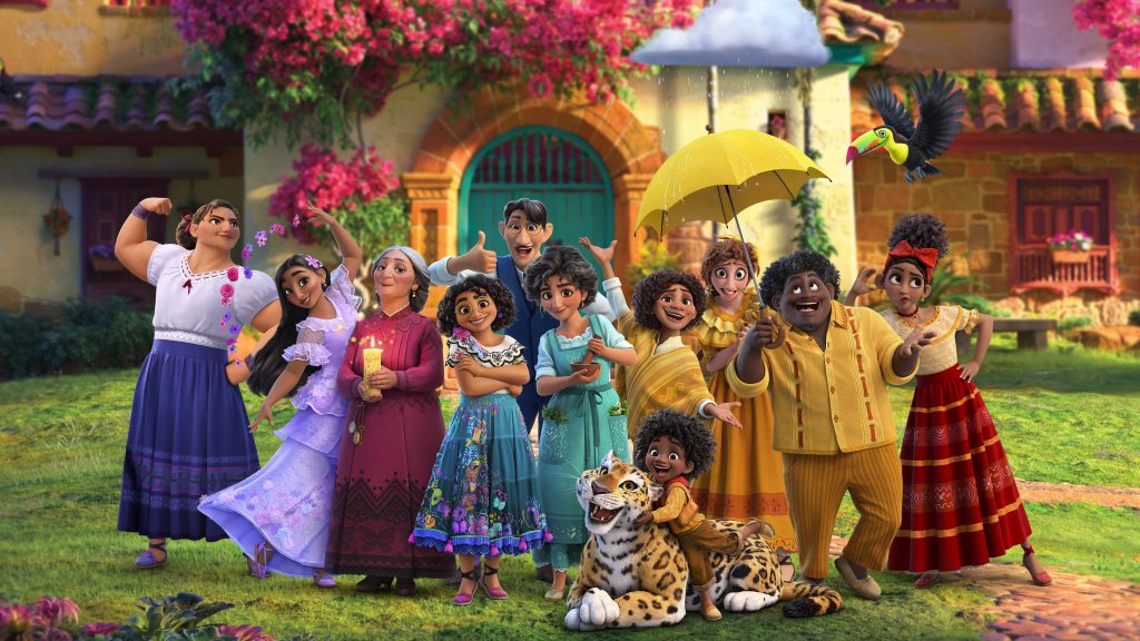 The colorful and vibrant Madrigal family together in front of their magical casita in the new Disney animated film set in Colombia ENCANTO.