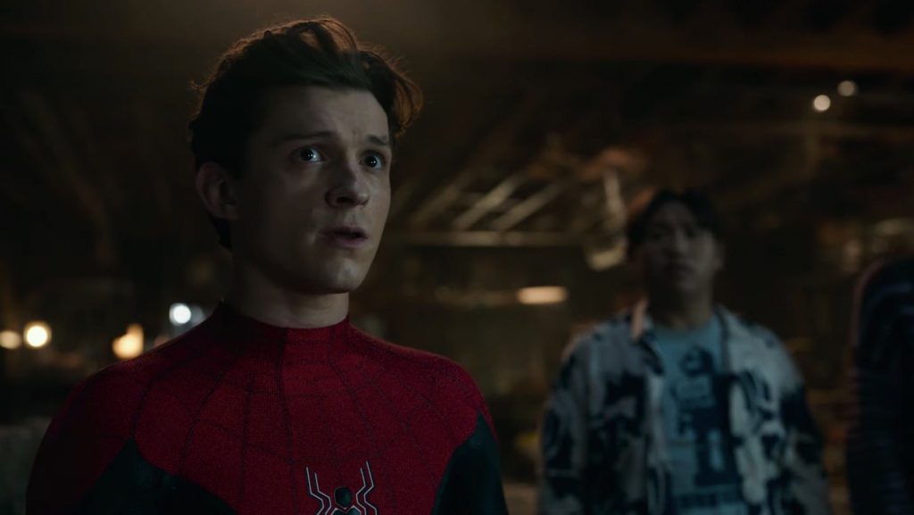 Tom Holland as Spider-Man maskless stands in shock with best friend Ned played by Jacob Batalon in Doctor Strange's Sanctum Sanctorum in SPIDER-MAN: NO WAY HOME written by Erik Sommers and Chris McKenna.