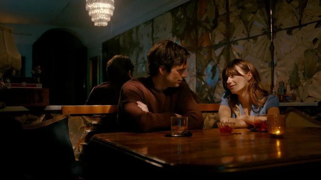 Sebastian Stan and Daisy Edgar-Jones share drinks and enjoy a first date together at a nice, low-lit restaurant in the new genre thriller FRESH from director Mimi Cave.