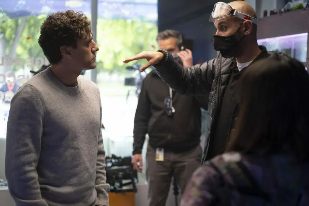 Director Mohamed Diab walks lead star Oscar Isaac through a scene on the set of the Marvel Disney+ series MOON KNIGHT.