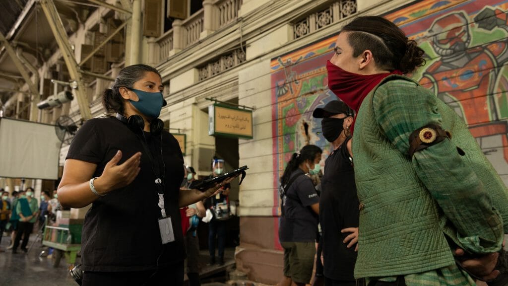 Sharmeen Obaid-Chinoy walks Aramis Knight in full costume as the Red Dagger on the Karachi, Pakistan set of the MCU Disney+ series MS. MARVEL.