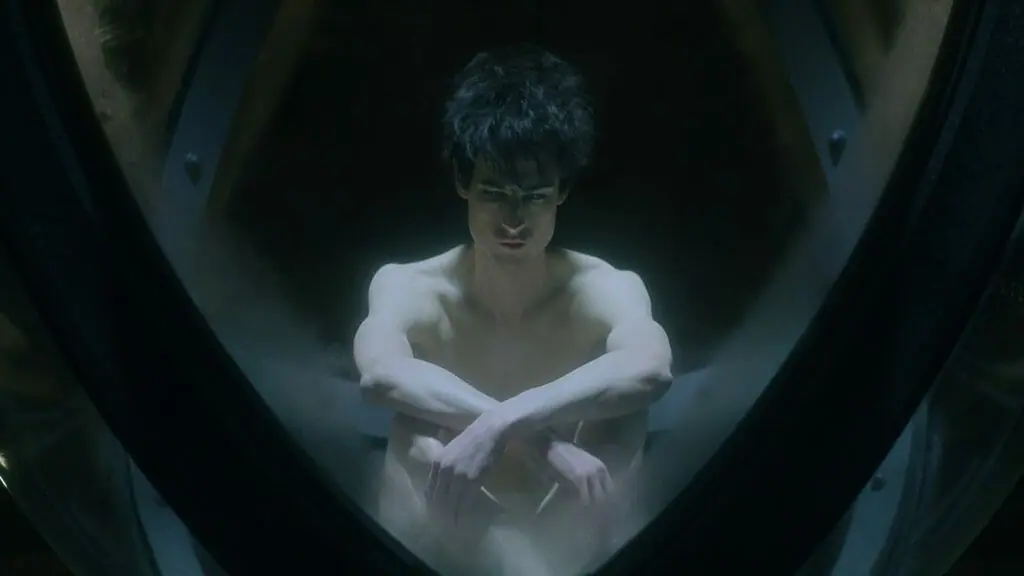 Morpheus aka Dream played by Tom Sturridge meditates shirtless in his magical orb prison where he can't use his dream abilities and is dreamed powerless in THE SANDMAN on Netflix.