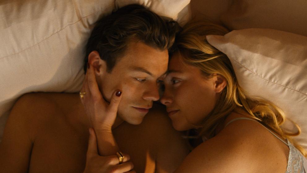 Harry Styles and Florence Pugh share a romantic moment as they wake up in bed together in DON'T WORRY DARLING.