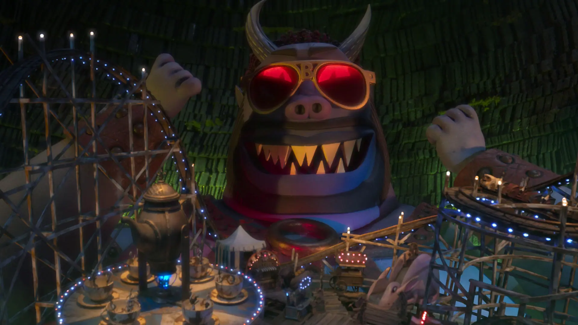 The giant purple demon Buffalo Belzer voiced by Ving Rhames wears his groovy red shades as he watches the amusement park of lost souls on his belly in WENDELL & WILD on Netflix.