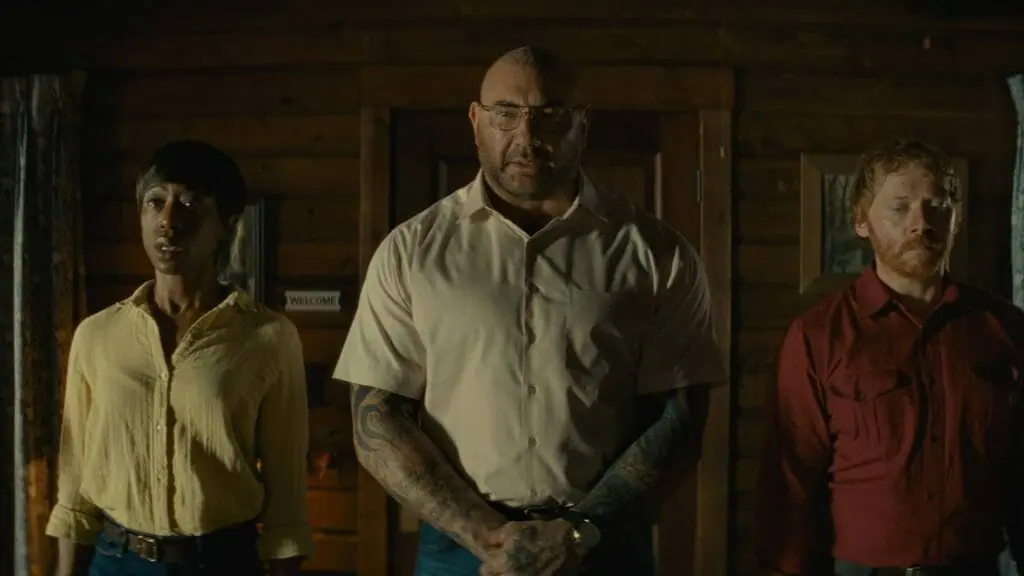 Dave Bautista, Nikki Amuka-Bird, and Rupert Grint star as the home invaders and horsemen of the apocalypse in the psychological horror film KNOCK AT THE CABIN directed by M. Night Shyamalan.
