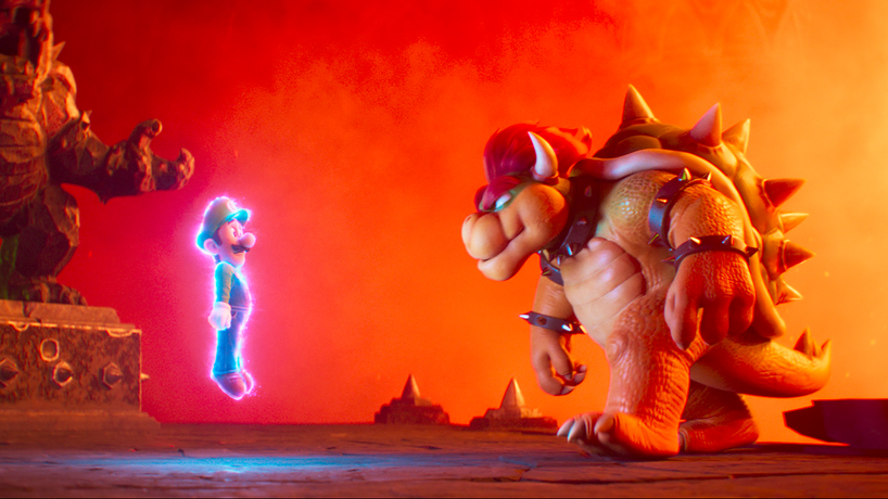 Luigi voiced by Charlie Day  is held captive by Bowser voiced by Jack Black in his fiery rock castle in THE SUPER MARIO BROS. MOVIE from Illumination and Universal Pictures. 