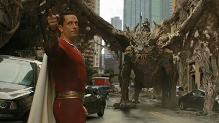 Zachary Levi as Shazam faces off against Lucy Liu as Kalypso riding a giant dragon in SHAZAM! FURY OF THE GODS coming to HBO Max in May 2023.