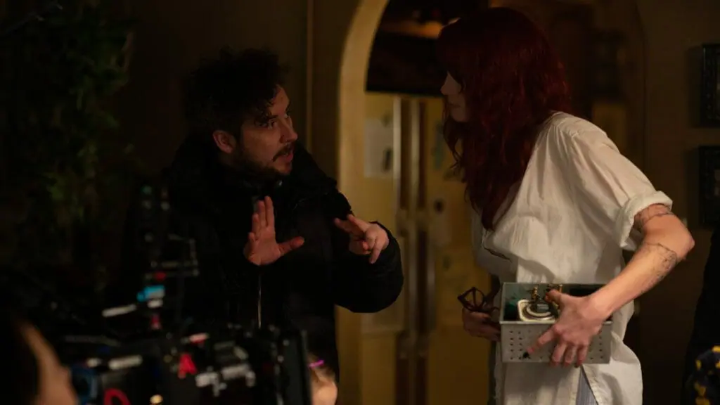 Director Lee Cronin gives notes to actress Alyssa Sutherland on the Los Angeles apartment set of EVIL DEAD RISE.