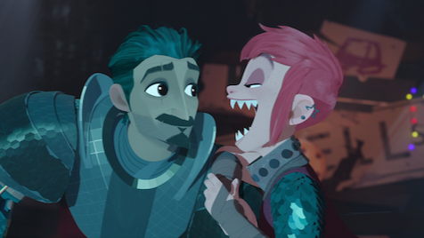 The knight Ballister Blackheart voiced by Riz Ahmed and Nimona the shapeshifter voiced by Chloë Grace Moretz share a happy moment together as Nimona shows off her razor sharp teeth in the Netflix original animated film NIMONA.