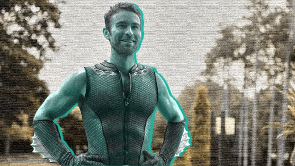 Chace Crawford stars as The Deep in the Herogasm episode from THE BOYS Season 3 in a new turquoise blue graphic for our exclusive interview.