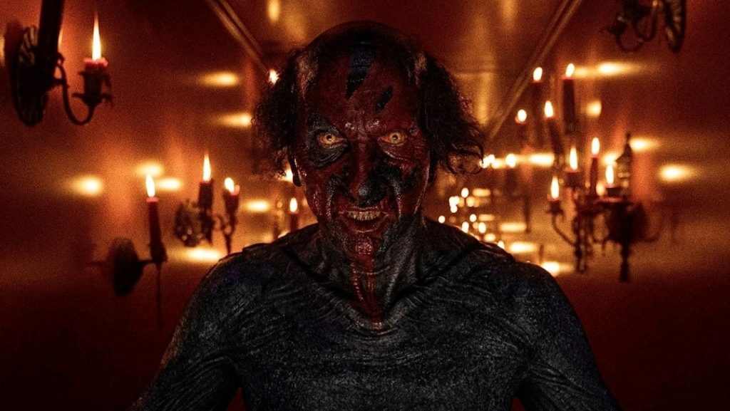 The evil Lipstick-Face Demon returns in INSIDIOUS: THE RED DOOR, produced by James Wan and Jason Blum.