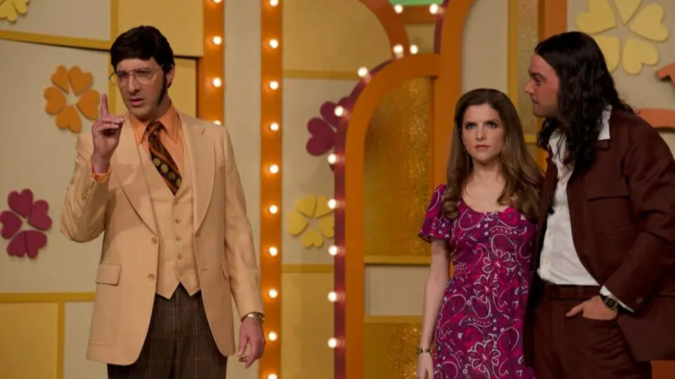 Tony Hale stars as game show host Jim Lange next to Anna Kendrick as Cheryl Bradshaw and Daniel Zovatto as serial killer Rodney Alcala on The Dating Game in the movie WOMAN OF THE HOUR.