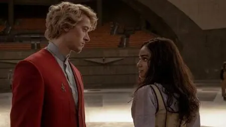 Tom Blyth as Coriolanus Snow and Rachel Zegler as singer Lucy Gray Baird have an intense stare off in THE HUNGER GAMES: THE BALLAD OF SONGBIRDS & SNAKES.