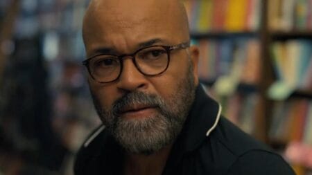 Jeffrey Wright stars as Thelonious "Monk" Ellison looking confused as he shops in a bookstore in the comedy drama film AMERICAN FICTION.