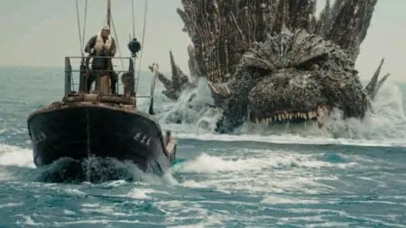 Godzilla swims fast and chases down a small fishing boat in the sea from GODZILLA MINUS ONE which just got added to the Netflix streaming service in June 2024.