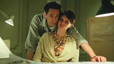 Adrien Brody and Felicity Jones embrace each other in the new historical epic drama film THE BRUTALIST.