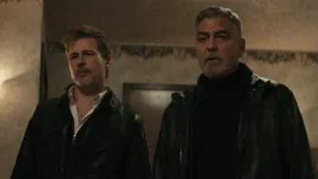 Brad Pitt and George Clooney star as two professional fixers looking hilariously confused next to each other in the action comedy WOLFS directed by Jon Watts for Apple TV+.