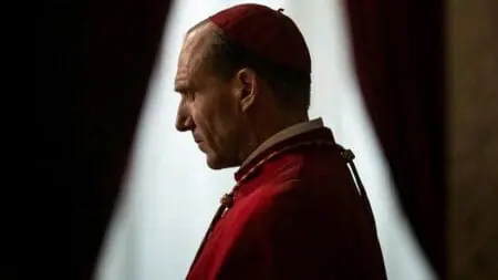Ralph Fiennes stars as Cardinal Thomas Lawrence, the dean of cardinals in the Roman Catholic Church, in the religious and political mystery film CONCLAVE.