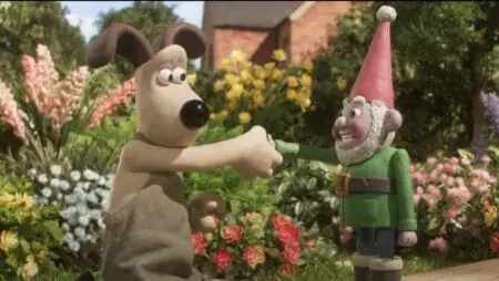The loveable dog Gromit shakes the hand of Norbot, a robotic AI garden gnome, in the stop-motion animated film WALLACE & GROMIT: VENGEANCE MOST FOWL on Netflix.