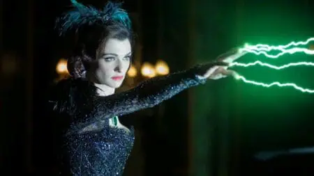 Rachel Weisz stars as Evanora the Wicked Witch of the East shooting green lightning from her fingertips in the movie OZ THE GREAT AND POWERFUL, which is getting added to Disney+ and Hulu in November 2024