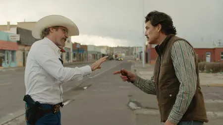 ‘Eddington’ Review – Ari Aster’s Extremely Polarizing, Dark American Satire Joaquin Phoenix as Sheriff Joe Cross and Pedro Pascal as Mayor Ted Garcia face off in a tense conversation while trying to practice social distancing in the middle of an empty New Mexico town square in the black comedy film EDDINGTON.
