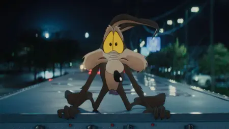 Wile E. Coyote on top of a moving truck in 'Coyote Vs. ACME'