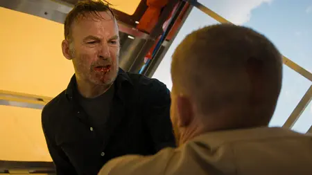 Bob Odenkirk Explains the Action Philosophy of ‘Nobody 2’ (EXCLUSIVE) Bob Odenkirk stars as Hutch Mansell with blood showing on his teeth as he pins a bad guy down and prepares to beat him with his fists in the action sequel NOBODY 2.