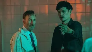 Actor Bob Odenkirk and director Timo Tjahjanto block out a stunt under some neon green lighting on the set of the action sequel NOBODY 2.