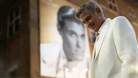 George Clooney stars as the aging movie star Jay Kelly looking dashing in an all-white suit in the new Netflix film written and directed by Noah Baumbach.