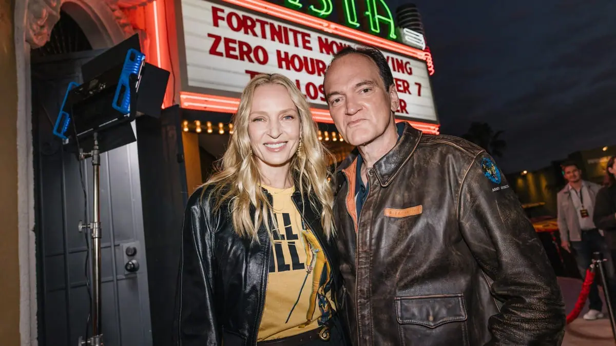 Uma Thurman and Quentin Tarantino pose together outside of the iconic Vista Theater in Hollywood for the premiere of The Lost Chapter: Yuki's Revenge animated short soon to be in Fortnite. 