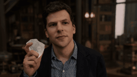 Jesse Eisenberg stars as the leader of the Four Horsemen magicians, J. Daniel Atlas, holding up a large shiny diamond to his face in the sequel NOW YOU SEE ME: NOW YOU DON'T.