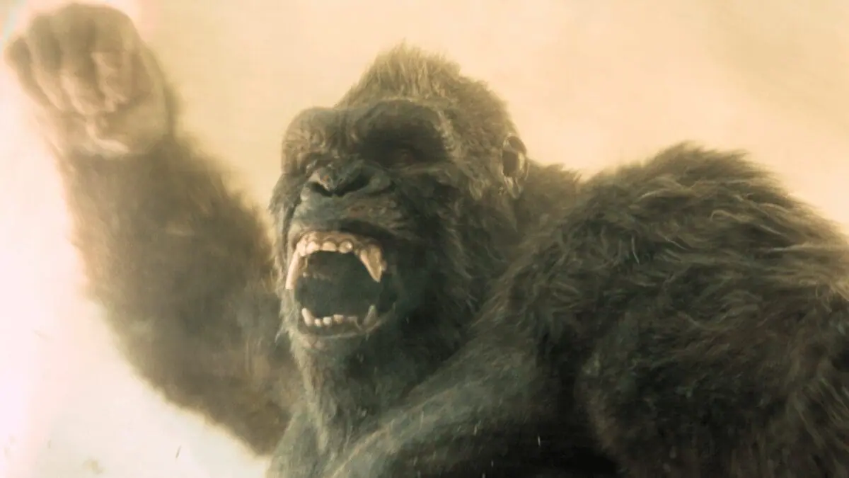 An epic shot of the giant ape known as Kong raising his fist in the air as he prepares to throw a powerful punch in MONARCH: LEGACY OF MONSTERS Season 2. 