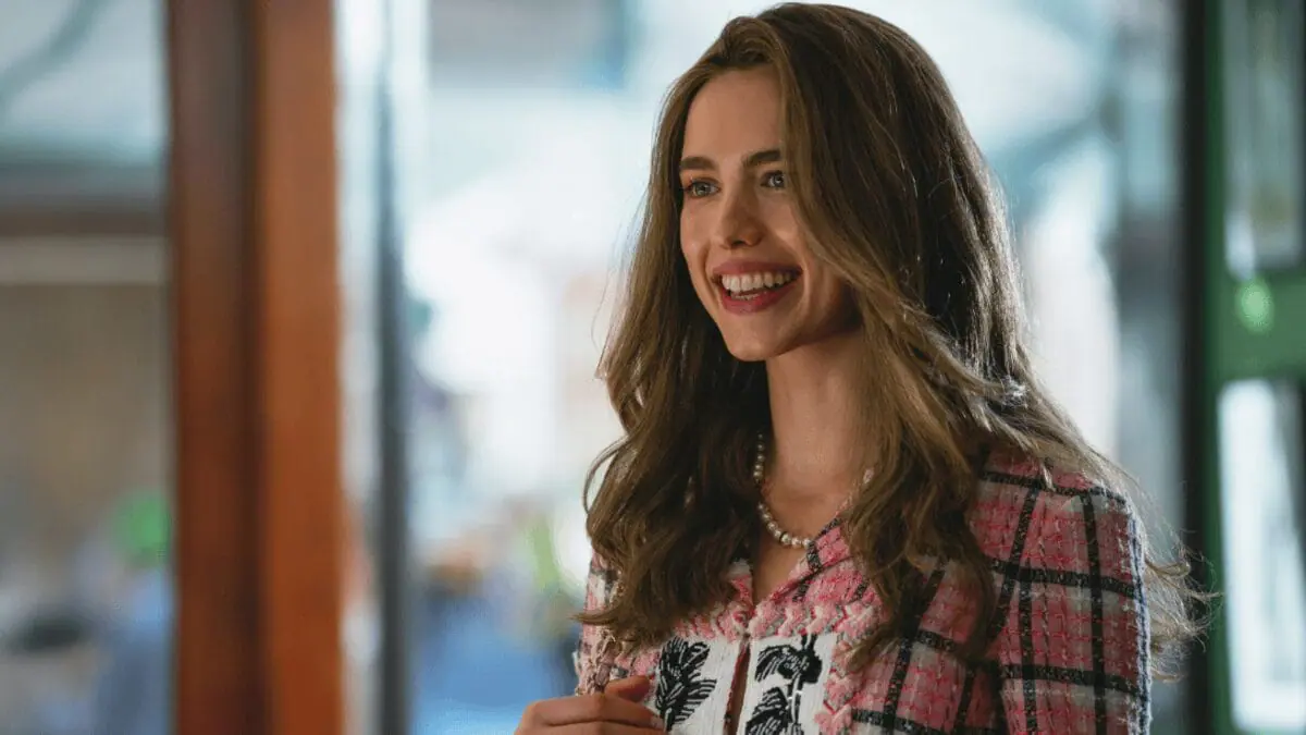 Actress Margaret Qualley shows of her beautiful hair with a large smile in the A24 thriller HOW TO MAKE A KILLING. 