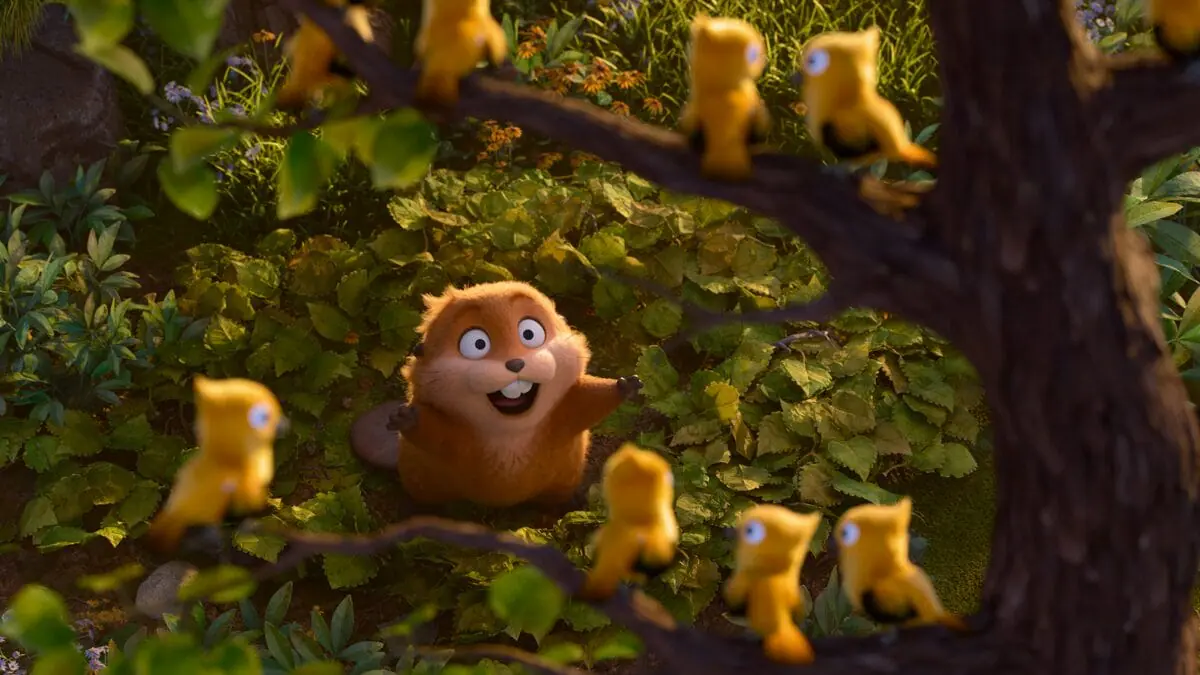 Mabel the beaver looks up with a huge cartoony smile and admires a group of pretty yellow birds perched on the branches of a tree in Pixar Animation's original animated movie HOPPERS.