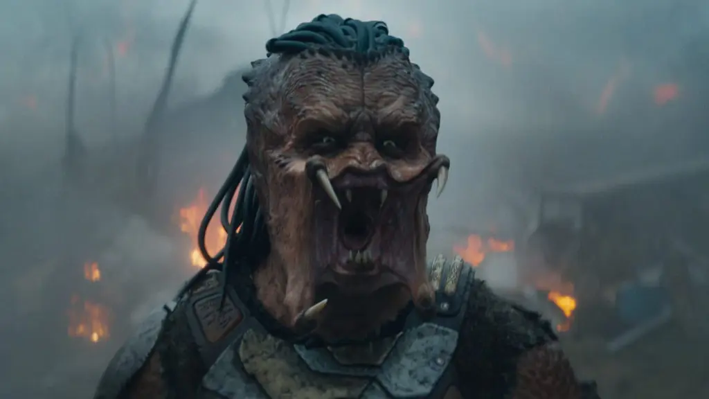 Dek the young runt Yautja warrior lets out a huge roar showing off his sharp mandibles as he prepares to go into battle in PREDATOR: BADLANDS.