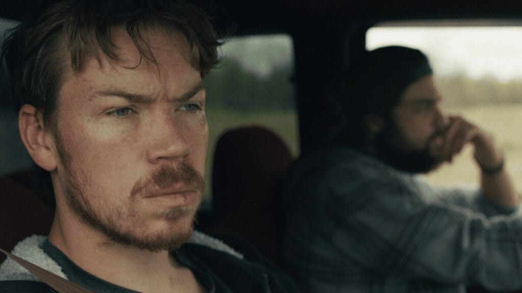 ‘Union County’ Review – Will Poulter Shines in a Genuine and Tender Depiction of Addiction A close-up shot of Will Poulter and Noah Centineo riding in a car together with somber facial expressions in the opioid addiction drama UNION COUNTY.