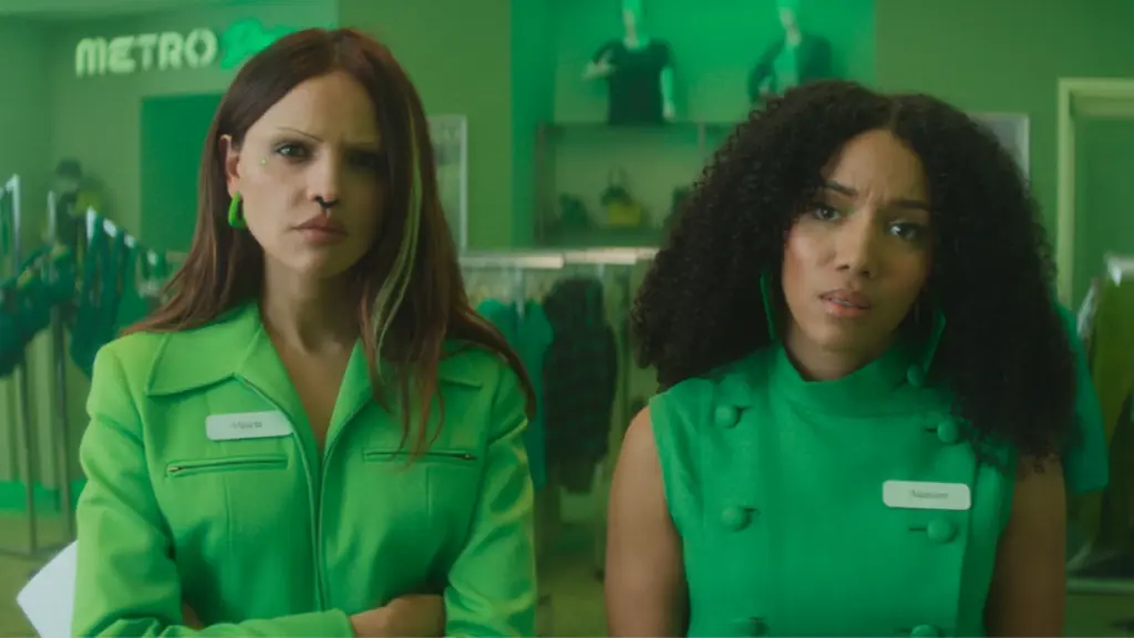 Eiza González and Najah Bradley rock all-green attire working at the popular fashion store Metro Designers in Boots Riley's I Love Boosters. 