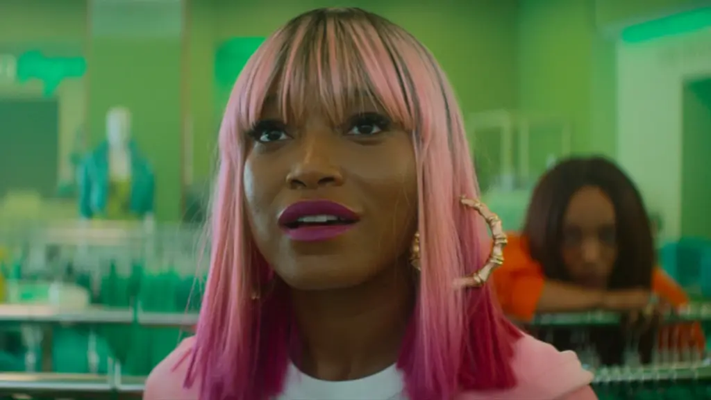 Keke Palmer rocks a short pink haircut as Corvette the professional shoplifter and aspiring fashion designer in I LOVE BOOSTERS. 