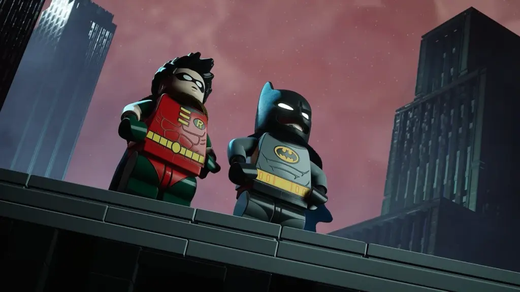 Robin and Batman pose together on top of a building in Gotham City like in the iconic intro from Batman: The Animated Series in the new video game LEGO BATMAN: LEGACY OF THE DARK KNIGHT.