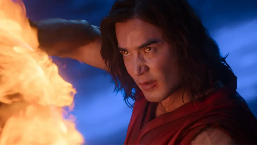 An awesome shot of Liu Kang, played by Ludi Lin, blocking a hit with his fire powers in the live-action sequel MORTAL KOMBAT II. 