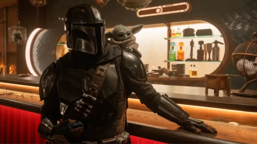 The Mandalorian and the adorable Baby Yoda enter a futuristic alien bar in the Star Wars movie spin-off THE MANDALORIAN AND GROGU.